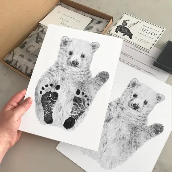 Our keepsakes collection helps you treasure every memory of your newborns life. Image features Lucy Coggle's polar bear footprint kit.