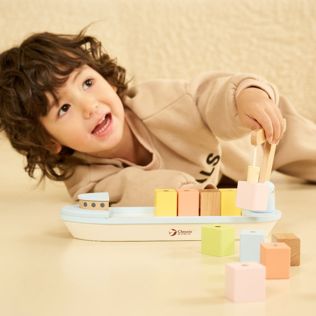 Classic World create wooden toys to educate, entertain and challenge children. The image features their Block Boat toy.