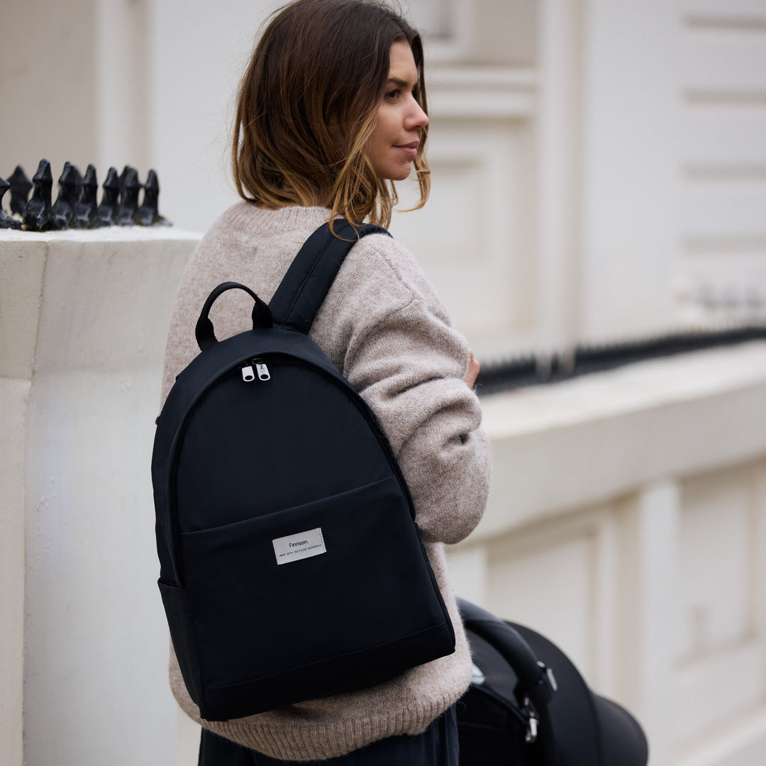 Finnson create beautifully simplistic changing bags. Image features the inge eco changing bag in black.