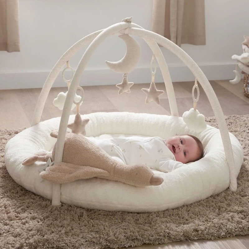 Image shows young child sitting in the 3 in 1 Booster Seat in Blossom from Mamas & Papas.