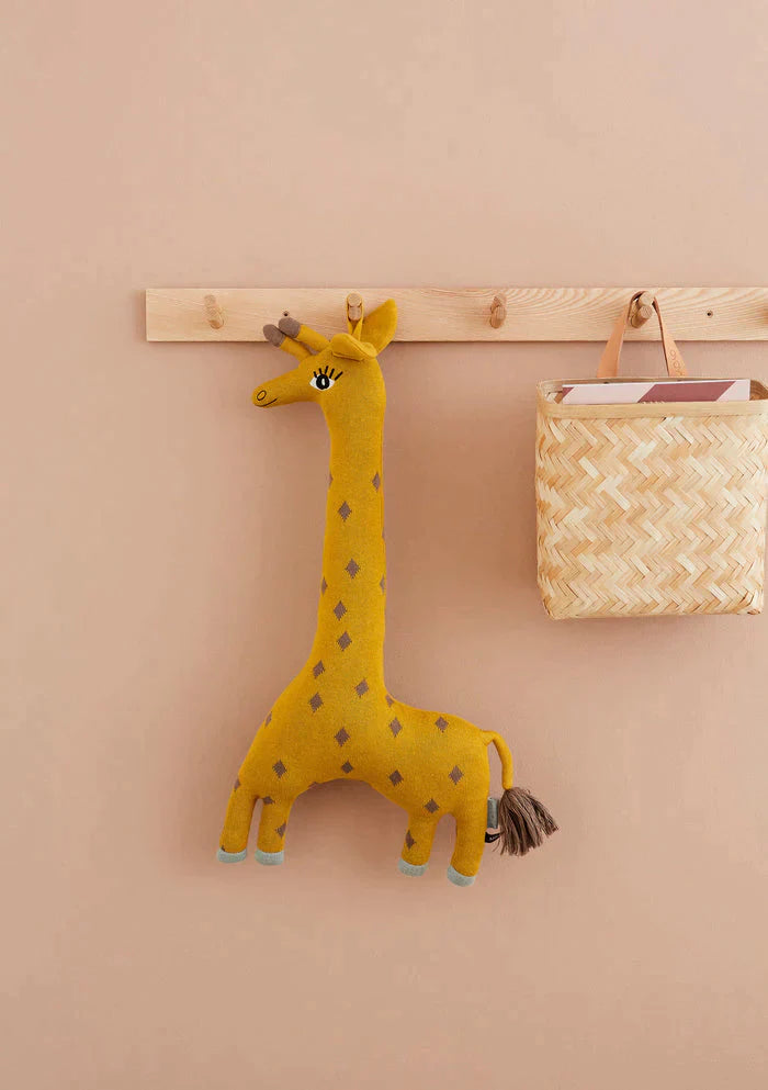 OYOY creating classic, functional and long lasting products. The image features an adorable Noah Giraffe toy from OYOY mini collection.
