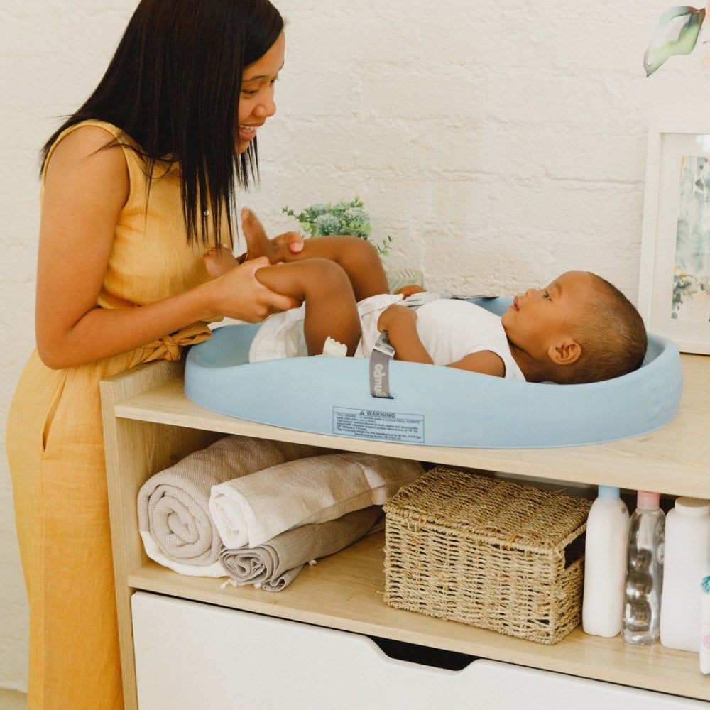 Bumbo create simplified, quality and functional products for both parents and little ones. The image features their changing pad.