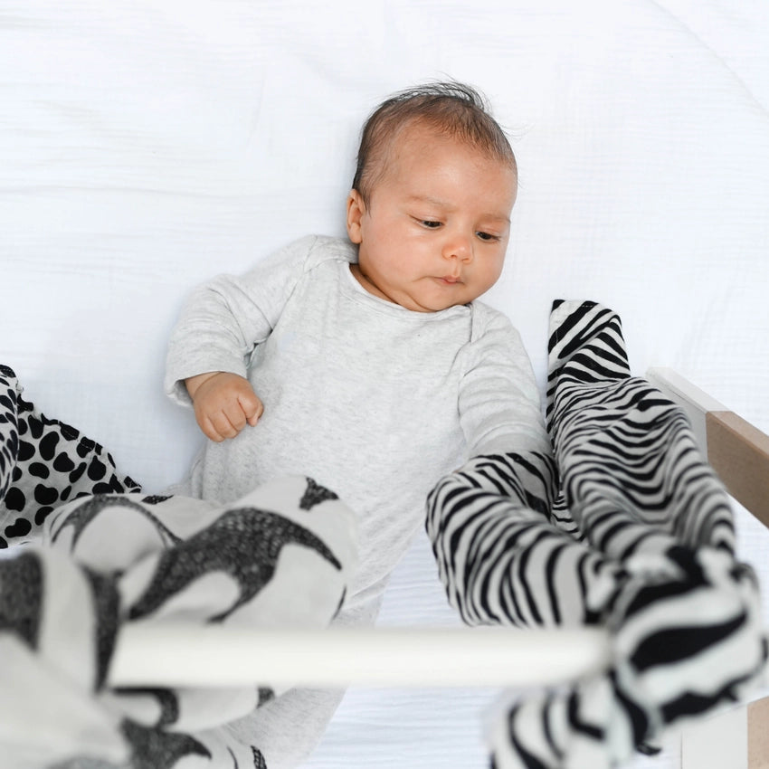 Etta Loves UK creates products featuring sensory patterns to mesmerise your little ones. The image features the Etta Loves UK sensory muslin pack.