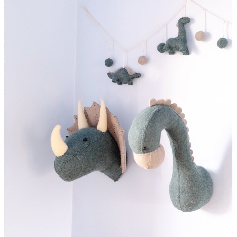 Fiona Walker create a range of quirky and fun animal themed home decor. The image features a range of products from their dinosaur collection.