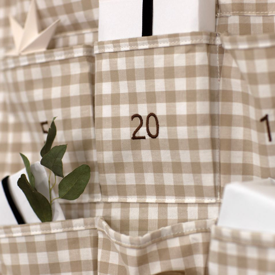 Plaid advent calendar with numbers and small plants