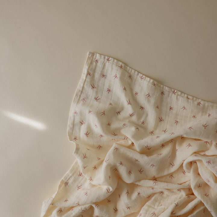 Mushie - Organic Swaddle - Bows - Mabel & Fox