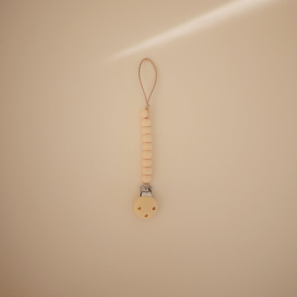 Mushie - Silicone Pacifier Clip - Hera Pale Yellow - Mabel & Fox