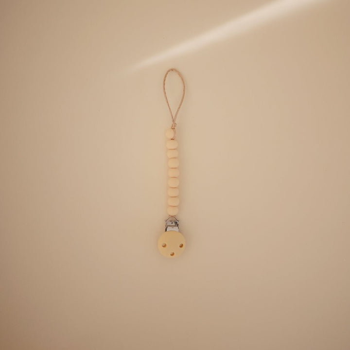 Mushie - Silicone Pacifier Clip - Hera Pale Yellow - Mabel & Fox
