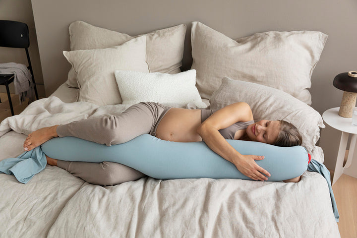 Perfect for side sleeping, the bbhugme Pregnancy Pillow Kit in Eucalyptus and Coral is from Mabel & Fox