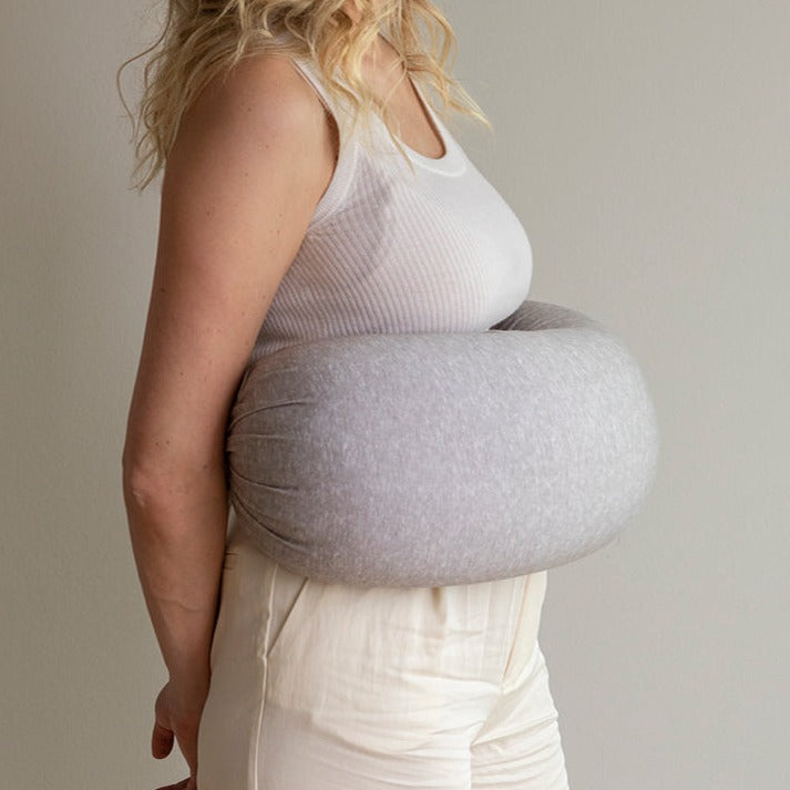the bbhugme nursing pillow in grey melange, supports you and your baby whilst feeding. 