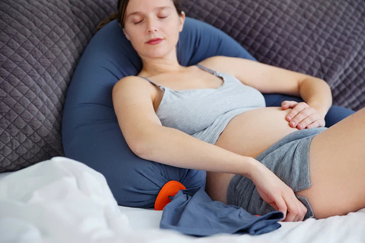 The bbhugme Pregnancy Pillow in Dusty Blue and Orange supports you whilst sitting